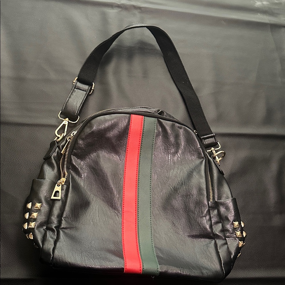 ❤️SOLD❤️New fashionable backpack 
Black/ red & green stripes
Zippers and studs